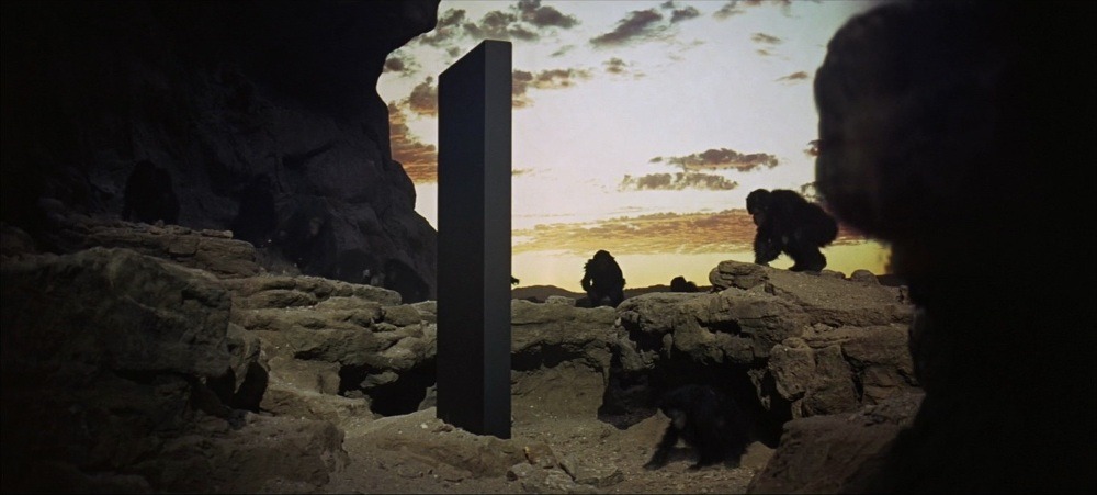 2001space odyssey with monkey staring at the black monolith